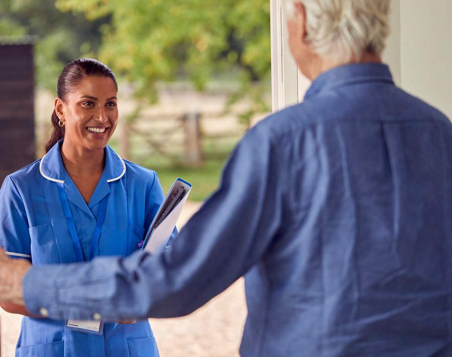 Patient letting Professional inside for Home Care