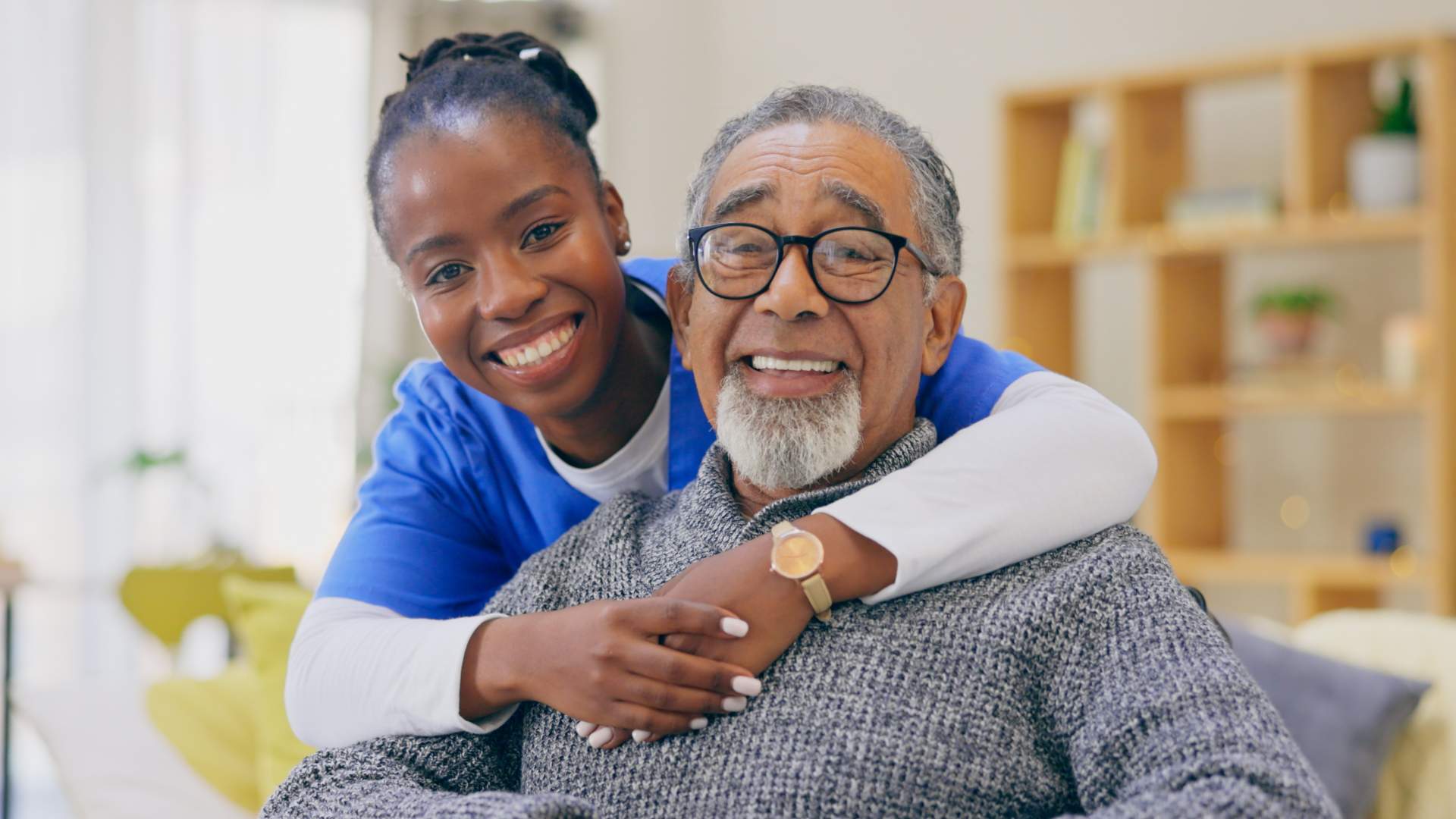 Professional healthcare worker showing care for a male senior